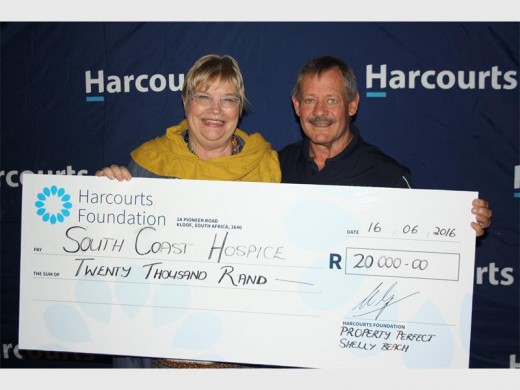 Thank you: Mike Willemse of Harcourts hands over a cheque for R20 000 to South Coast Hospice's Di van Dyk. The funds were raised at a golf day at Port Shepstone Country Club last Thursday.
