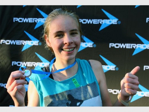 Winning ways: Caitlyn Schlehmeyer was overjoyed at taking first position in the 4km female fun run. 4079vee
