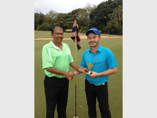 Well played: Pro-Vision's fourth monthly mug played at Port Shepstone Country Club recently, was won by Keagan Ray who carded 39 points on the day. Ashoo Singh presents him with his trophy, whuch was sponsored by Shiva Clothing. In second place was Anba Pillay on 38 points, on a countout from Keenon Choonoo.