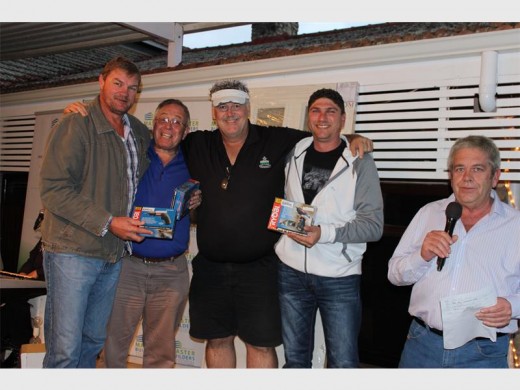 Almost: Runners-up in the Wozani Berg Gasoline golf day were the South Coast Herald team of (from left) Attie Barrington, Bevis Fairbrother, Bernd Kankowski and Jaco Buitendag. Glen Smit does the honours.