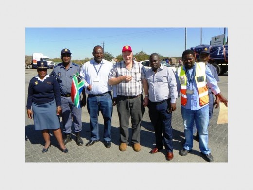 Customs and police officers see the team off at Beitbridge border post, Zimbabwe.