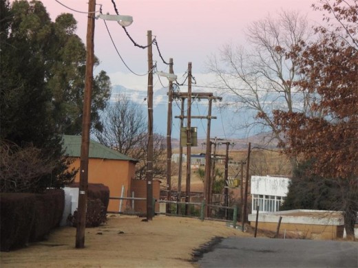 Snow covered mountains form a backdrop to the village of Van Reenen.