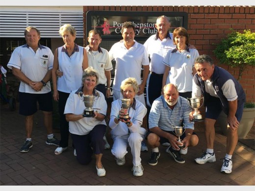 On target: Celebrating after the Port Shepstone Country Club bowls champs are (back, from left) Roy Anderson, Winnie Hess, Alan Jacobson, Kevin Lancaster, Rob McArthur and Ann Payn; (front) Sharon Bischoff, Gill Thiele, Eddie Fann and Mark Smith.