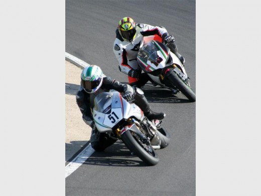 Revved up: Bikers tear up the track in order to win the title. 1785vee