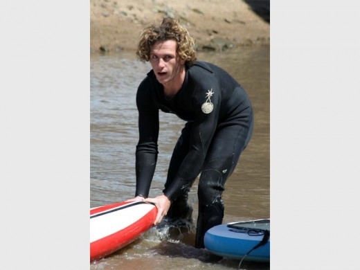 Hard work: Luke Langeberg of Southport gets his stand up paddle board ready. 2250vee