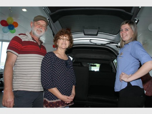 Spacious: Simone Hunlun (right, sales executive at Honda Auto) shows Pieter and Erika Burger of Port Edward the large boot space on the Honda BR-V. 2770vee