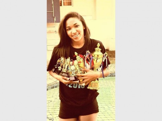 Golden girl: Jordan Frost with a bagful of trophies.