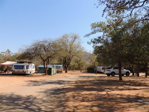 The well-treed camping area is an oasis after the road through the harsh, dry mountainous terrain.