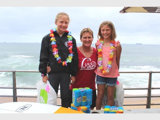  Heather Clark (middle) congratulates Gabi Herbst (left) and Mayah Potgieter at the Lizzard Hurricane Summer Surf competition's prize-giving.
