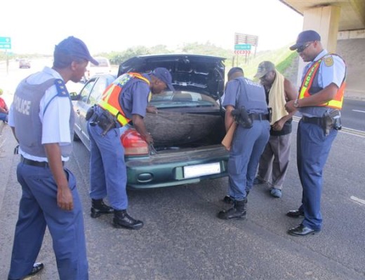 Police conduct a vehicle check in Hibberdene yesterday.