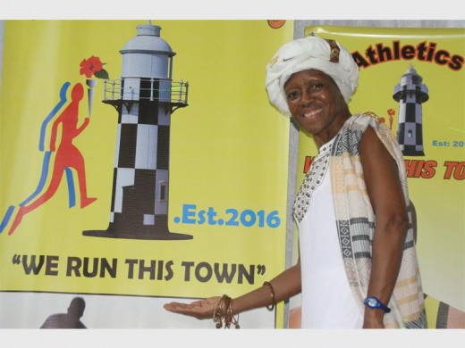 It's official: Guest of honour Blanche Moila unveils Ugu Athletics Club's emblem. 6453vee