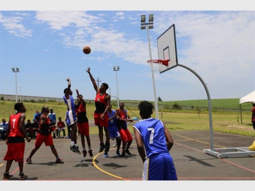 Aerial battle: Zululand district players (in red) block another attack from Ugu district players in an entertaining basketball game at Ugu Sports and Leisure Centre.