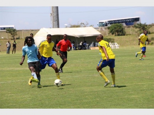 Tried hard: Ugu's men's football team (in yellow shirts) could not match last year's form where it reached the final. This time, the locals could not get out of the group stage.