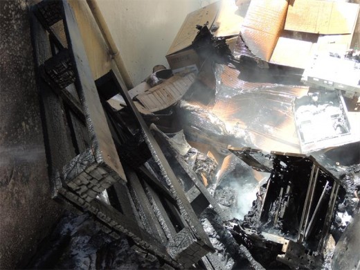 Packaging material and wooden pallets caught alight in an alley between the South Coast Herald and Nashua buildings in Port Shepstone.