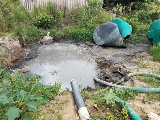 Messy: The state of the site when Ugu District replaced the temporary water tanks with septic tanks.