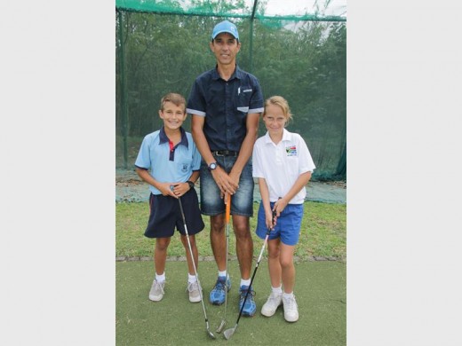 On the fairways: Golf coach Petrus Ferreira provides training to Ryan Nel and Danelle Mans. 0055vee