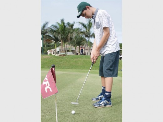 Perfection: Johann Jooste perfects his putt. 0072vee