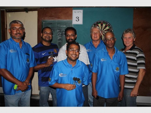 Bullseye: Ready to take on other players during the competition are Status Darts Club. They are (back, from left) Rakesh Ramdhun, Bupendra Prakash, Rishen Manilal, Scott Maclean and Clive Hurn with Kumesh Bilala and Anthony Moodley in front. 9328SN