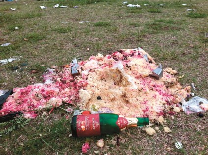What a lot of rice: A pile of food dumped where a wedding was reportedly held on the island on Saturday