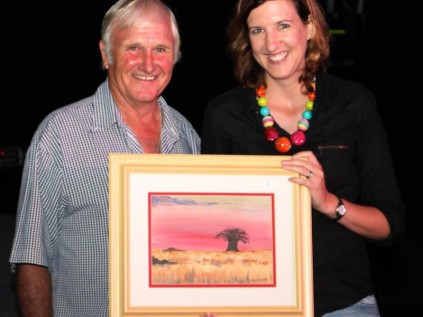 Vice-Chairman of the Leisure Gardens Governing Body Errol Scandlers awards auction winner Di McIlrath