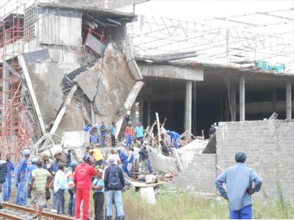 Rescuers scour through the concrete rubble on Tuesday after an entire floor the size of a soccer field collapsed at a mall under construction in Tongaat PHOTOS: Surie Singh of Makhulu News