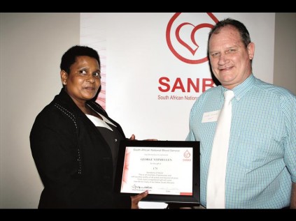 Accepting his 225th award is George Vermeulen with Sister Brenda Khuluse, SANBS Collections Manager, North Branch