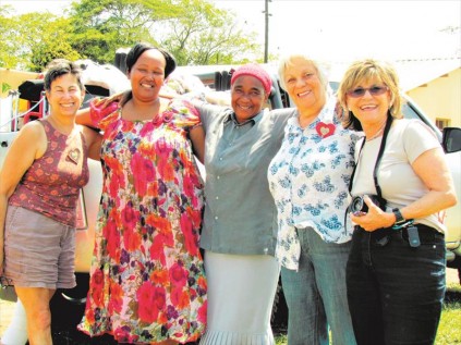 Carne-Joe Bloomgarten, Principal Thoko Nxumalo, Cresentia Ngobese - founder of Khulani, Sylvia Heymann and Sass Greenspan pose for a photo before offloading the new fleet of wheelchairs