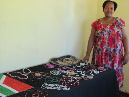 Principal Thoko Nxumalo presenting some of the crafts made by the students