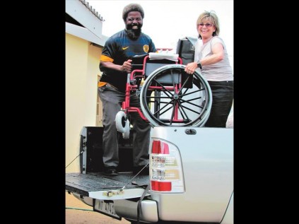 Phila Mdlaza and Sass Greenspan offloading one of the new wheelchairs