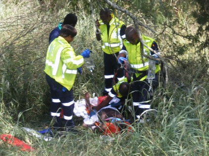 Medics treat the occupants from the truck