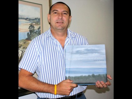 Richards Bay photographer Graeme Swarts with his copy of the book signed by the princess