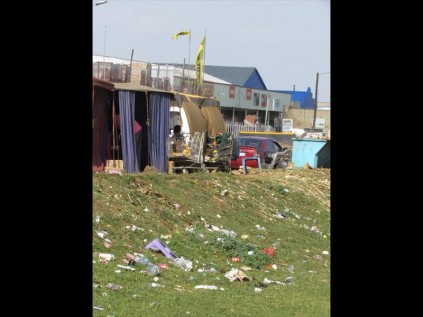 The embankment in front of rudimentary trading stalls is covered in litter the length of the main road running alongside it and getting worse by the day PHOTO: Tamlyn Jolly