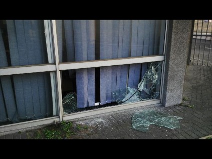 The window that was smashed open to gain entry to DHL Richards Bay