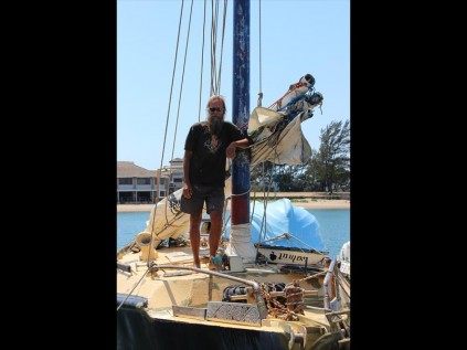 Kris standing on the flush, steel deck of 'Kahaar'. From Richards Bay he plans to head south to Cape Town, from where he wants to cross over to Brazil