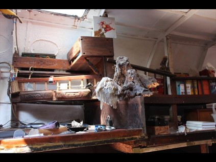 The chart/work table inside Kahaar is the only furnishing in an otherwise bare steel hull