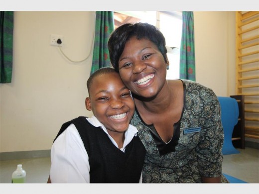 Wheelchair bound Nonthokozo Shandu (12) with Occupational Therapist Thobile Mdwande. Nonthokozo has therapy sessions every day for 45 minutes