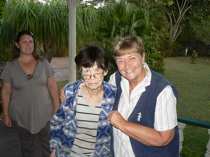 Jenny Harrison looks on as Ann Strauss is hugged by her sister, Pat Bryson