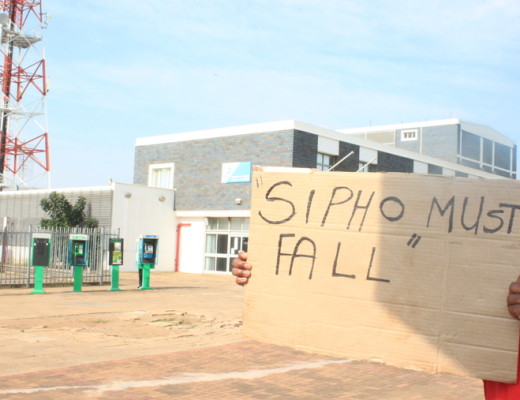 A protester holds up a sign outside the Empangeni Telkom offices last week, referring to Telkom CEO Sipho Maseko Photo - Wellington Makwakwa