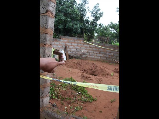 The body of the murdered girl was found in a shallow grave at the killer's homestead