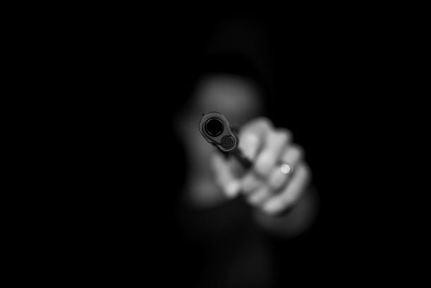 max-kleinen-ugdKmhDg1m8-unsplash gun hijack criminal