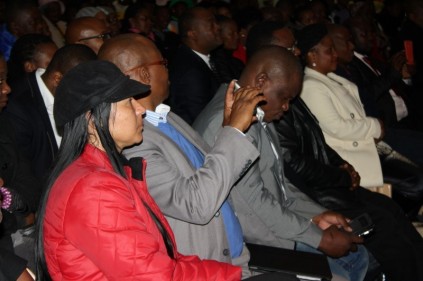 Candidate-councillor for Ward 112 Leverne Young listens to Gauteng Premier David Makhura.