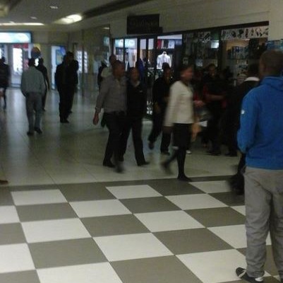 Shopper hastily leave Boulders Mall after the bomb scare is announced. Photo: Twitter/@musomello