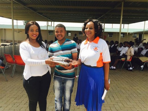 Thabisile Rakgoto and founder of Divine Favour  Mentorship and Coaching, Patience Baloyi, flank one of the beneficiaries from Kaalfontein Secondary School.