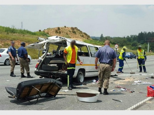 Metro police and emergency workers at the scene of the N1 South taxi crash that killed one person and injured 11.