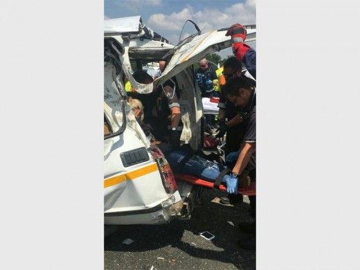 Paramedics rescue a passenger at the scene of the N1 South taxi crash that killed one person and injured 11.