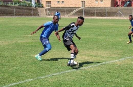 Alex Black Poison player Sihle Shange protects while Neasm Ernest Ngobeni presses.