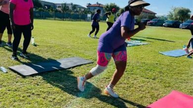 Midrand Royals parent liaison officer Cynthia Raseboya exercises with parents.