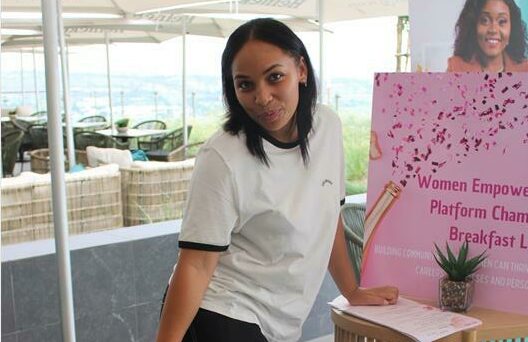 Christine Brigham poses for the photo before the start of the breakfast session.