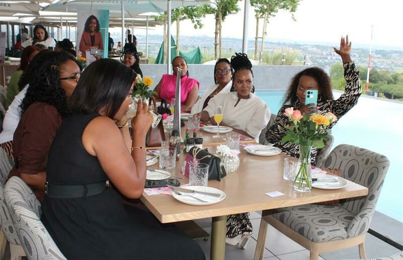 Attendees enjoy themselves at Katia Ribeiros womens empowerment breakfast launch.