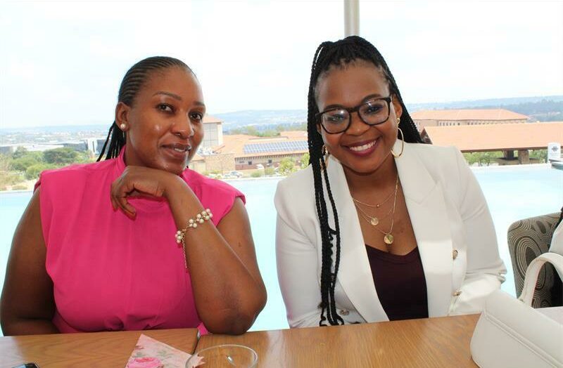 Agnella Nawa and Dr Pearl Makhwiting share smiles at the breakfast launch.
